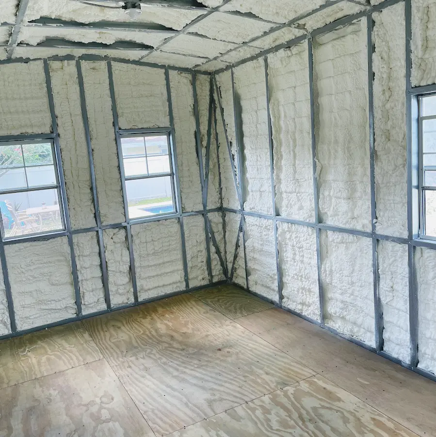 Closed-cell spray foam insulation applied to wall cavities in a residential project in Blakely